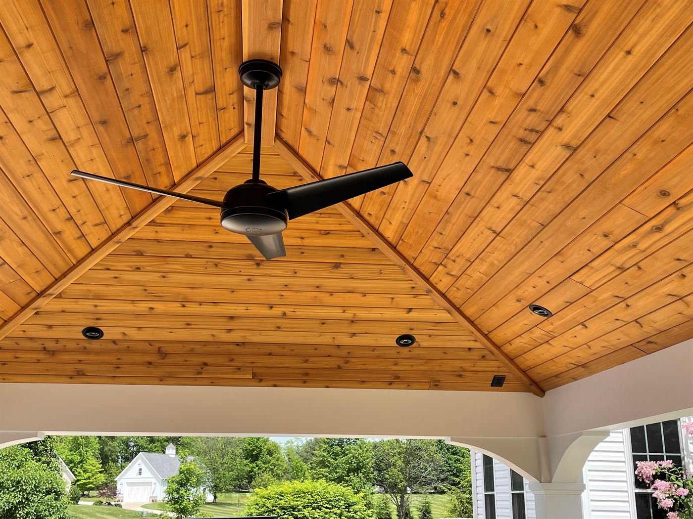 Covered porch with cedar cathedral ceiling by Stellar Construction