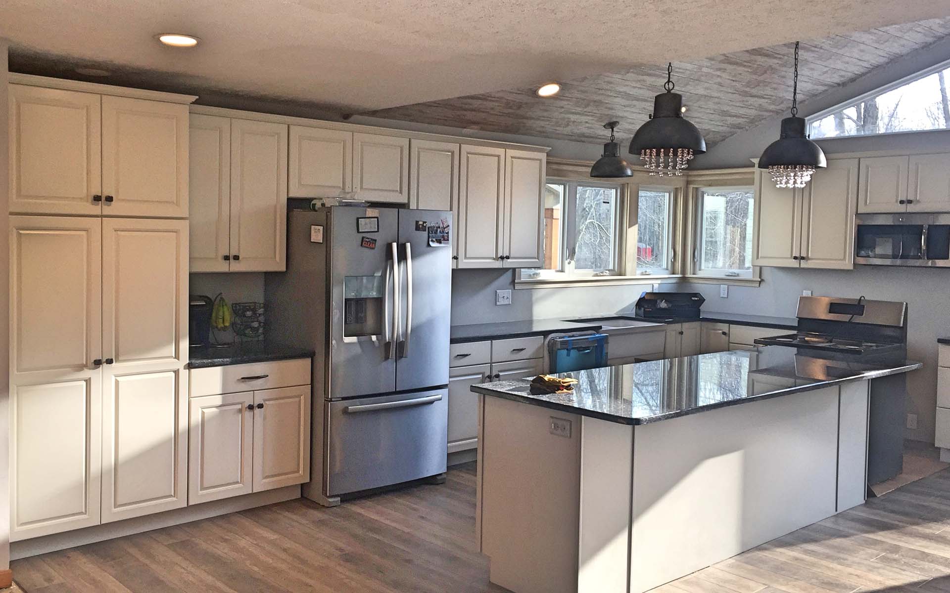 Kitchen remodel in progress with new cabinetry and island by Stellar Construction
