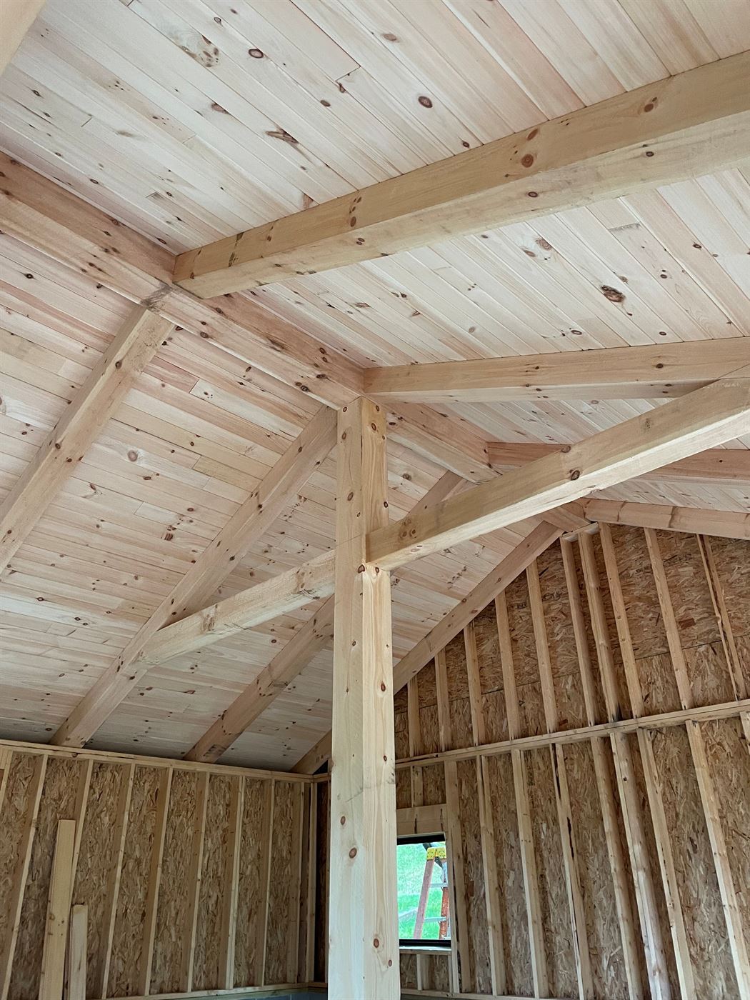 Timber-frame pool house addition under construction by Stellar Construction